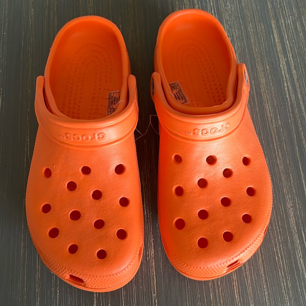 Orange Crocs.
